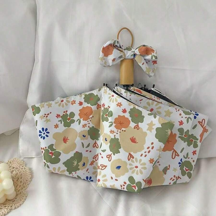 Umbrelă pliabilă compactă cu imprimeu floral galben și verde, la modă și minimalistă, strat negru pentru protecție solară și ploaie