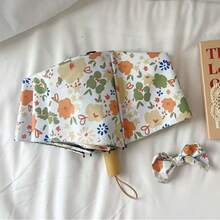 Umbrelă pliabilă compactă cu imprimeu floral galben și verde, la modă și minimalistă, strat negru pentru protecție solară și ploaie