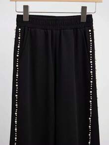 Pantaloni larghi eleganti da donna con vita elastica, tasche, patchwork e dettagli in finta perla - nero - Visualizzare 4