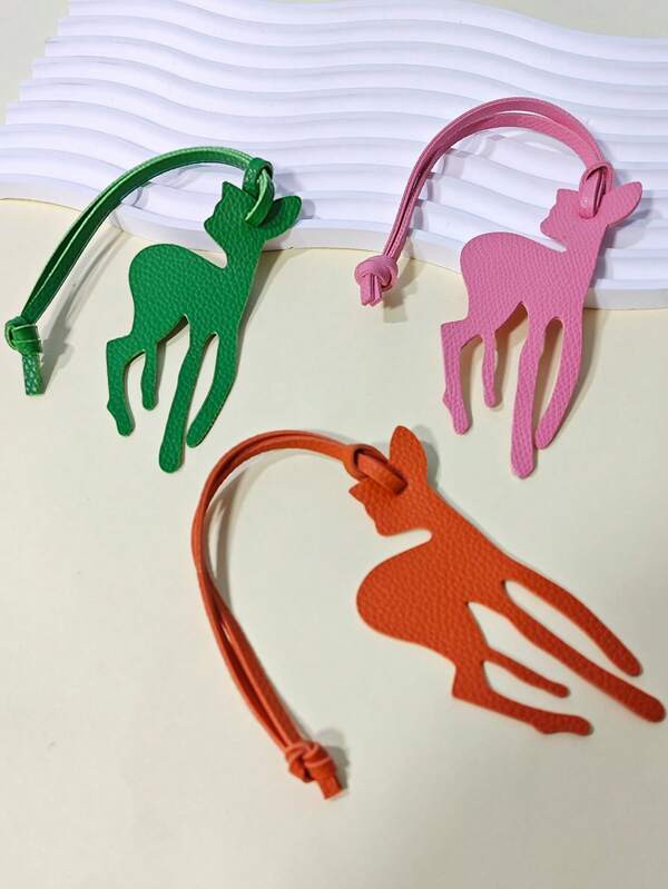 This Solid-Color PVC Leather Keychain Features A Simple, Stylish, Novel, And Fun Cartoon Deer Shape. It's A Multi-Functional Keychain For Backpacks, Handbags, Shoulder Bags, Suitcases, And Car Keys, Serving As A Decorative Item For Everyday Wear, Holidays, Dates, Vacations, And Travel. It's An Ideal Gift For Family, Friends, And Lovers.