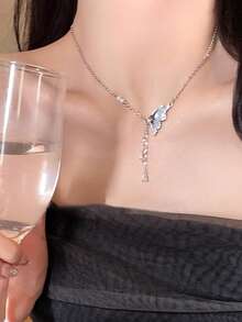 1pc Butterfly Tassel Necklace Designed For Modern Women Who Appreciate Light Luxury And Korean Style Aesthetics This Elegant Piece Features A Delicate Butterfly Pendant With A Flowing Tassel Creating A Captivating Movement That Adds A Touch Of Femininity To Any Outfit Crafted With Hypoallergenic Materials And An Adjustable Chain It Ensures Comfortable All Day Wear Without Irritating Sensitive Skin The Waterproof And Tarnish Resistant Properties Maintain Its Radiant Appearance Through Continuous Wear Making It Perfect For Daily Activities Whether Youre Attending A Party Wedding Music Festival Or Enjoying A Beach Vacation This Necklace Effortlessly Enhances Your Style Its A Thoughtful Gift For Girlfriend Mom Daughter Or Friends Celebrating Special Occasions Like Birthdays Anniversaries Or Holidays With Its Timeless Design And Meaningful Symbolism