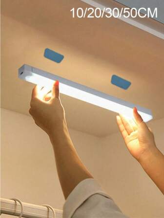 1 pieza Tira de luz LED cálida con sensor de movimiento USB de 10/20/30/50 cm - Perfecta para gabinete, armario y pasillo, Tira de luz LED con sensor de movimiento inalámbrico para debajo del gabinete, Lámpara nocturna magnética recargable para pasillo, cocina, estante del gabinete, armario, decoración del hogar