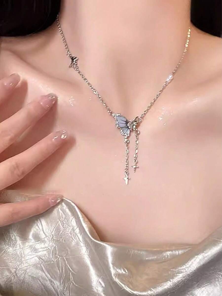 1pc Butterfly Tassel Necklace Designed For Modern Women Who Appreciate Light Luxury And Korean Style Aesthetics This Elegant Piece Features A Delicate Butterfly Pendant With A Flowing Tassel Creating A Captivating Movement That Adds A Touch Of Femininity To Any Outfit Crafted With Hypoallergenic Materials And An Adjustable Chain It Ensures Comfortable All Day Wear Without Irritating Sensitive Skin The Waterproof And Tarnish Resistant Properties Maintain Its Radiant Appearance Through Continuous Wear Making It Perfect For Daily Activities Whether Youre Attending A Party Wedding Music Festival Or Enjoying A Beach Vacation This Necklace Effortlessly Enhances Your Style Its A Thoughtful Gift For Girlfriend Mom Daughter Or Friends Celebrating Special Occasions Like Birthdays Anniversaries Or Holidays With Its Timeless Design And Meaningful Symbolism