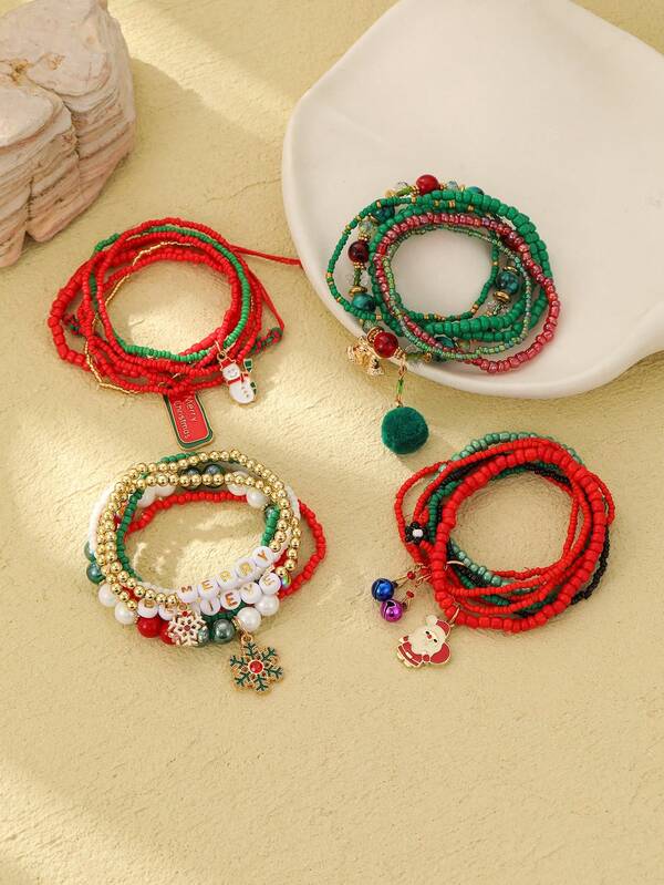 Set de 6 pulseras de mujer con elementos navideños, copos de nieve y decoración de Papá Noel