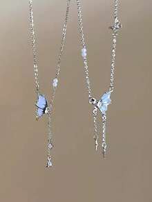 1pc Butterfly Tassel Necklace Designed For Modern Women Who Appreciate Light Luxury And Korean Style Aesthetics This Elegant Piece Features A Delicate Butterfly Pendant With A Flowing Tassel Creating A Captivating Movement That Adds A Touch Of Femininity To Any Outfit Crafted With Hypoallergenic Materials And An Adjustable Chain It Ensures Comfortable All Day Wear Without Irritating Sensitive Skin The Waterproof And Tarnish Resistant Properties Maintain Its Radiant Appearance Through Continuous Wear Making It Perfect For Daily Activities Whether Youre Attending A Party Wedding Music Festival Or Enjoying A Beach Vacation This Necklace Effortlessly Enhances Your Style Its A Thoughtful Gift For Girlfriend Mom Daughter Or Friends Celebrating Special Occasions Like Birthdays Anniversaries Or Holidays With Its Timeless Design And Meaningful Symbolism