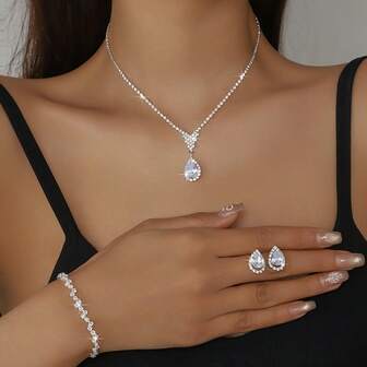 Conjunto de joias de luxo para noivas: 1 par de brincos, 1 colar e 1 pulseira, com design em gota d'água cravejado de zircônias cúbicas brilhantes.