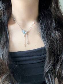 1pc Butterfly Tassel Necklace Designed For Modern Women Who Appreciate Light Luxury And Korean Style Aesthetics This Elegant Piece Features A Delicate Butterfly Pendant With A Flowing Tassel Creating A Captivating Movement That Adds A Touch Of Femininity To Any Outfit Crafted With Hypoallergenic Materials And An Adjustable Chain It Ensures Comfortable All Day Wear Without Irritating Sensitive Skin The Waterproof And Tarnish Resistant Properties Maintain Its Radiant Appearance Through Continuous Wear Making It Perfect For Daily Activities Whether Youre Attending A Party Wedding Music Festival Or Enjoying A Beach Vacation This Necklace Effortlessly Enhances Your Style Its A Thoughtful Gift For Girlfriend Mom Daughter Or Friends Celebrating Special Occasions Like Birthdays Anniversaries Or Holidays With Its Timeless Design And Meaningful Symbolism