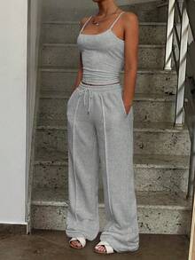 Bộ đồ thể thao tối giản màu trơn gồm áo tank top và quần jogger cạp chun, thích hợp cho mùa hè. - Màu Xám nhạt - Xem 7