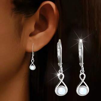 一对独特迷人的白色月光石8字形时尚925纯银吊坠耳环，适合派对/生日礼物和日常佩戴。