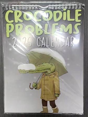 1份2026年趣味鳄鱼问答创意挂历。动物主题悬挂式月历，是送给宠物爱好者、家人、朋友、同事的绝佳圣诞节/新年/生日礼物。包含12个有趣的鳄鱼插图问答。幽默问答设计，适合家居、办公室、卧室装饰。
