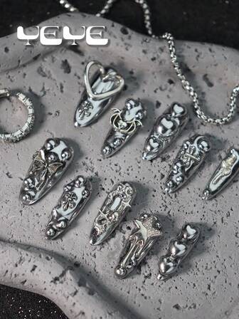 10 件长杏仁手工制作，欧式纯色闪亮金属银色，垃圾朋克酷女孩梳妆台全覆盖假指甲套装，摇滚风格，3D 立体装饰心形、蝙蝠、星星、玫瑰、蝴蝶结，新奇全覆盖亚克力按压指甲套装，适合女孩和女士，带 1 个迷你指甲锉和 1 张粘性标签