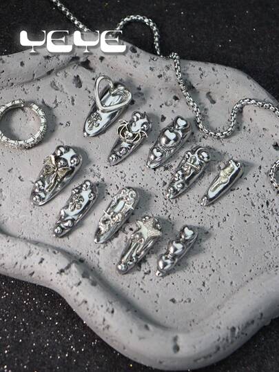 10 piezas de uñas postizas de almendra larga, estilo europeo de unicolor brillante de color plateado metálico, estilo punk chatarra, conjunto de uñas postizas de cobertura total para chicas y mujeres con estilo rock, decoración 3D de corazón, murciélago, estrella, rosa, lazo, novedad, con 1 lima de uñas mini y 1 hoja de pegatinas adhesivas
