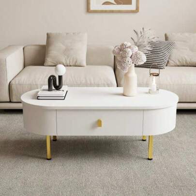 Soffbord med två lådor, guldfärgade handtag och ben, svängda hörn.