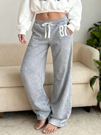 Pantalones de chándal holgados para mujer, bordado #87, cintura baja, cinturilla de color contrastante, cordón, bolsillos en diagonal, pierna acampanada, cómodos para el hogar/diario/ropa de calle, estilo deportivo retro, otoño/invierno