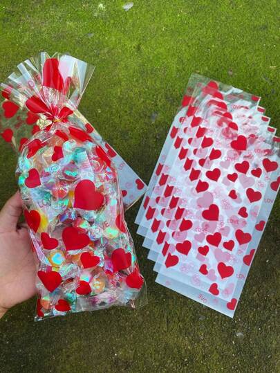 50 piezas Bolsas planas de regalo con impresión de corazón rojo LOVE, emparejadas con cordones de atar dorados, bolsas de regalo transparentes con decoración de corazón para el Día de San Valentín, adecuadas para bodas, regalos de amantes, parejas y decoración de fiestas temáticas