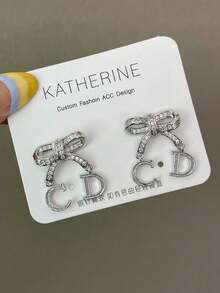 1 Set Fashionable Rhinestone CD Letter Hollow Bow Pendant Earrings, Elegant Jewelry Gift For Women, Suitable For Romantic Valentine's Day