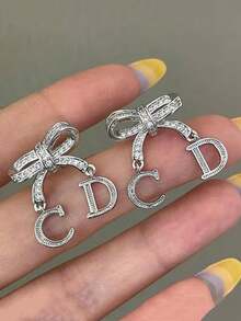 1 Set Fashionable Rhinestone CD Letter Hollow Bow Pendant Earrings, Elegant Jewelry Gift For Women, Suitable For Romantic Valentine's Day