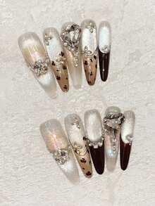 冬季美甲套装，10片椭圆形长尖甲片，棕色手绘豹纹美甲，棕色法式美甲，手绘不对称线条装饰，闪亮猫眼，歪心K9钻石镶嵌设计，小钻石缝线，高端奢华，适合约会、聚会、外出游玩等场合，可佩戴，可重复使用，手工按压式美甲套装，含果冻胶，迷你Rub One美甲用品手工按压式美甲片。 - 咖啡棕 - 查看 8