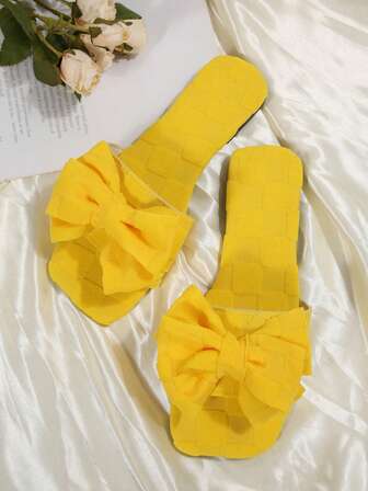 1 par enfärgade eleganta rosettknutna platta tofflor, lämpliga för inomhus- och utomhusbruk