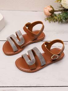 1 par de sandalias planas de color marrón talla grande para adolescentes, correas de PU de unicolor con decoración de brillantes de rhinestone, tacón en forma de S, hebilla metálica, correa con , punta redonda, antideslizante, moda y lujo, adecuado para niñas de 3 a 15 años, casual, fiesta, playa, primavera/verano 2026 - Marrón - Ver 4