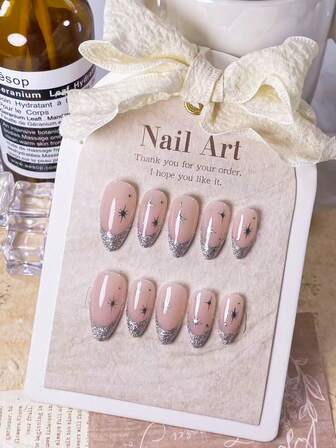 10 Pieces Of Handmade Almond-Shaped Almond Nails With Silver Sparkle And French Tips. Silver Star-Shaped Dots With Diamonds. High-End Ambiance. Bare Base With White And Green Diamonds, Adorned With Small Steel Beads. French Design. Simple, Stylish, Luxurious. Suitable For Any Occasion. Quickly Wearable And Removable; Push-Button Nail Design.