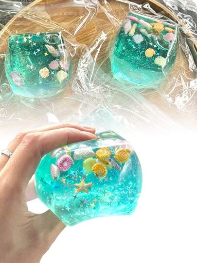 Cubo sensorial para alivio del estrés con tema de fiesta marina- Presenta un diseño adornado con conchas de dibujos animados, conchas de caracol, bancos de peces y elementos de helado, lo que efectivamente alivia la ansiedad. Ideal para lugares al aire entornos corporativos, brindando experiencias de alivio del estrés en cualquier momento y lugar. Una encantadora decoración de escritorio, ¡es el regalo perfecto para fiestas u ocasiones festivas!