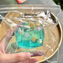 这款海洋主题感官减压魔方，以卡通贝壳、海螺、鱼群和冰淇淋元素点缀，营造出海洋派对氛围，有效缓解焦虑。它非常适合户外场所和公司环境，随时随地带来舒缓压力的体验。作为一款精美的桌面装饰品，它也是完美的派对礼品或节日礼物！ - 彩色 - 查看 6