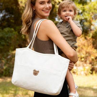1 حقيبة حفاضات بتطريز الدب الكرتوني الأنيق، سعة كبيرة قابلة للحمل باليد والكتف وتصميم متعدد الجيوب، مناسبة لأم وطفل كحقيبة لتجهيزات الأم والطفل