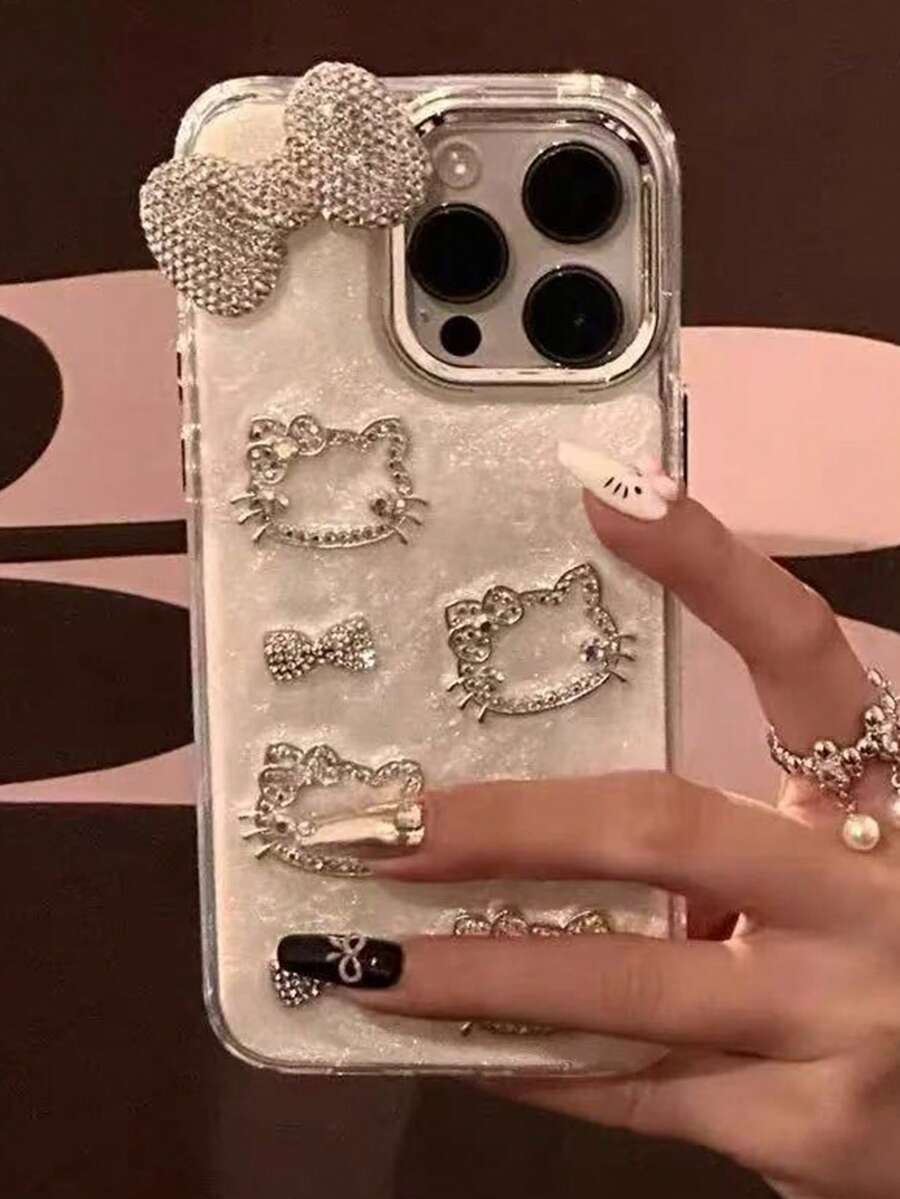 Sanrio Capa de Telefone Fashionable 3D com Laço de Strass Oco, Design de Gato Hello Kitty, Compatível com iPhone 16 Pro Max, 14, 15 Pro, 13, 12 Pro, Borda Macia Casco Rígido Anti-Queda, Adequado para Meninas e Mulheres - Prata - Visão 1