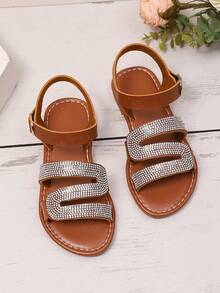 1 par de sandalias planas de color marrón talla grande para adolescentes, correas de PU de unicolor con decoración de brillantes de rhinestone, tacón en forma de S, hebilla metálica, correa con , punta redonda, antideslizante, moda y lujo, adecuado para niñas de 3 a 15 años, casual, fiesta, playa, primavera/verano 2026 - Marrón - Ver 5