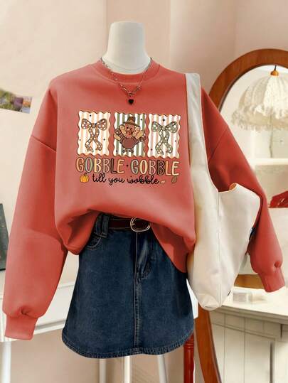 Sudadera de cuello redondo de manga larga con gráfico de pavo y eslogan "Gobble" para mujer, estilo casual y versátil, color naranja, ropa de moda para el Día de Acción de Gracias, adecuada para uso diario y festivo, con ambiente navideño