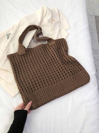 1个钩针镂空单肩手提包