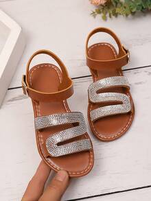 1 par de sandalias planas de color marrón talla grande para adolescentes, correas de PU de unicolor con decoración de brillantes de rhinestone, tacón en forma de S, hebilla metálica, correa con , punta redonda, antideslizante, moda y lujo, adecuado para niñas de 3 a 15 años, casual, fiesta, playa, primavera/verano 2026 - Marrón - Ver 7