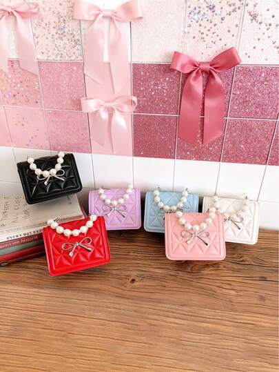 A New Mini Fashion Crossbody Bag With A Simple Opening And Closing Mechanism, Pearl Handles, Bow Embellishment, And Youthful Style, Metal Chain Strap, And Non-Adjustable Shoulder Strap. It's Casual And Stylish, Perfect For Outings, And Also Makes A Great Gift For Friends, Especially During Ramadan And Christmas.