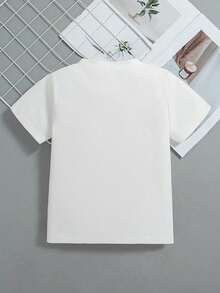Esta nueva camiseta de manga corta para niñas, 100% algodón, luce un estampado navideño y un corte holgado, informal y versátil. Confeccionada con un tejido suave y delicado con la piel, es suave con la piel sensible de tu hija, permitiéndole moverse con libertad y comodidad durante las reuniones familiares navideñas, los eventos escolares o los juegos al aire libre. - Blanco - Ver 2