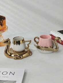 1 set Juego de taza y platillo de té con forma de animal dorado - Diseño elegante de camello y cisne, vajilla de té de cerámica de lujo con acentos metálicos, perfecto para decoración del hogar única y regalo para entusiastas del té