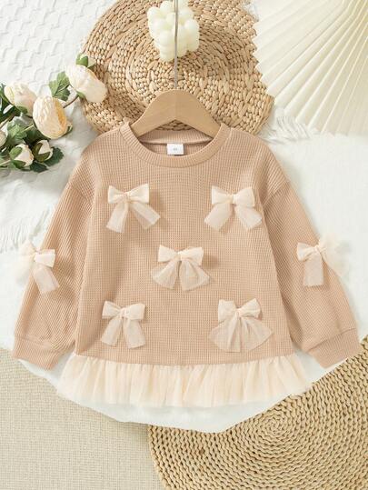 女童休闲纯色蝴蝶结装饰圆领落肩长袖上衣，春秋季