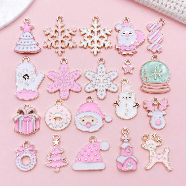 Un set di 20 ciondoli smaltati a tema natalizio rosa e bianco per accessori creativi fai-da-te, portachiavi e charm.