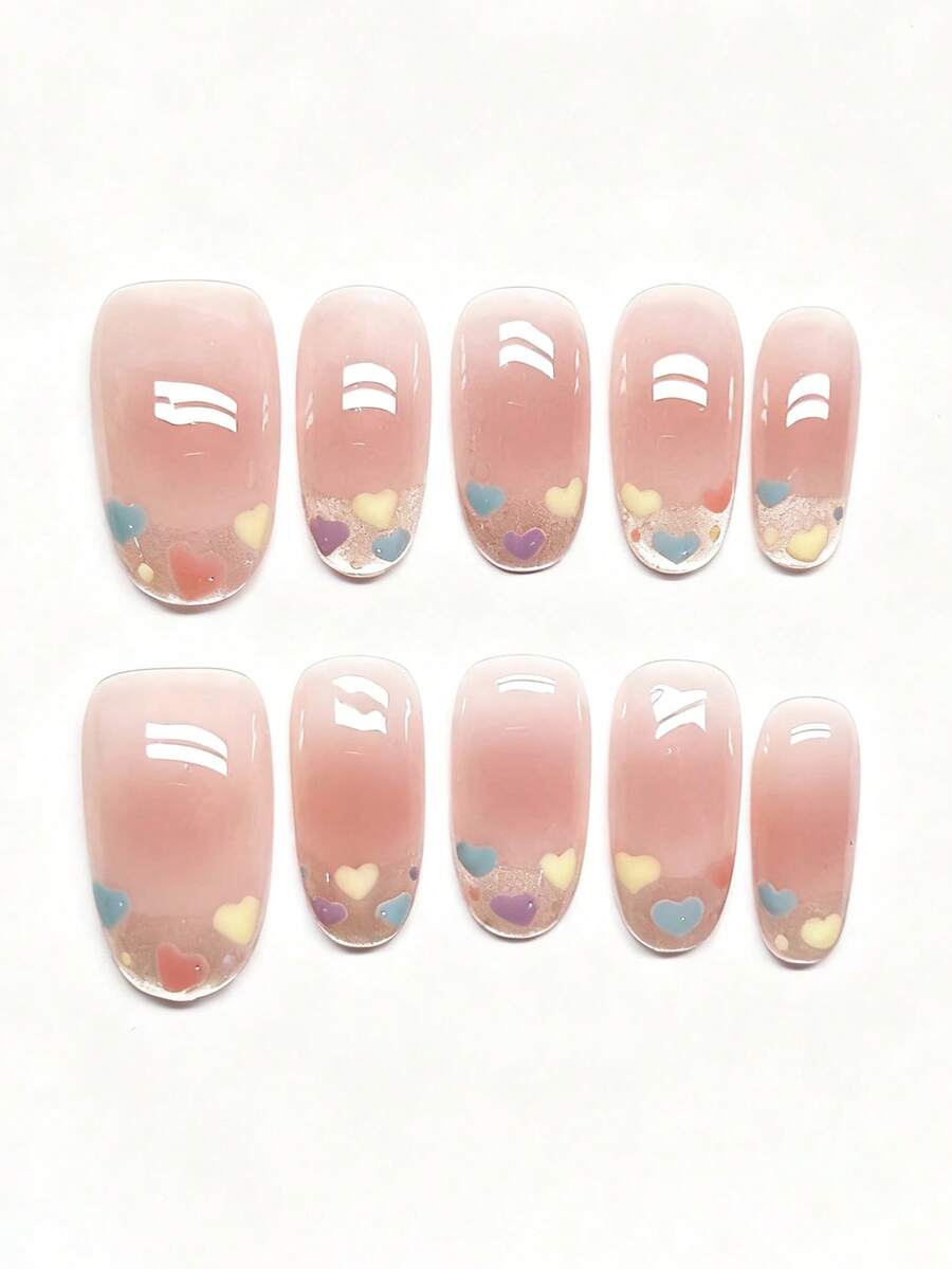 10 móng giả dán thủ công nguyên chất, móng dài, móng oval với màu hồng nude trong suốt làm nền, mang lại vẻ tự nhiên và mềm mại. Họa tiết hình trái tim vẽ tay với nhiều màu sắc khác nhau như xanh nhạt, vàng nhạt, tím nhạt và đỏ nhạt được thể hiện trong bộ sưu tập màu Macaron. Dụng cụ làm móng - Màu Hồng baby - Xem 1