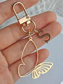 优雅合金蝴蝶及26个英文字母金色钥匙扣，A-Z字母镂空蝴蝶设计，精致包包挂件，适合挂在包包上或作为汽车装饰，是女士日常佩戴和朋友生日礼物的完美之选，也是日常必备单品和节日、生日、感恩节、圣诞节的理想礼物。 - 彩色 - 查看 23
