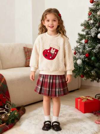 2pcs Set Of Girls' Christmas Outfits Includes A 1-Piece Christmas Red Stocking Pattern Embroidered Fleece Sweatshirt And A 1-Piece Thick Pleated Skirt Set (With Random Candy-Colored Decorative Pom-Poms). Soft And Comfortable Holiday Style, Perfect For Christmas Gifts, Decorations, Party Dresses, And Thickened Autumn/Winter Outfits For Girls. A Perfect Choice For Everyday Stylish Casual Wear.