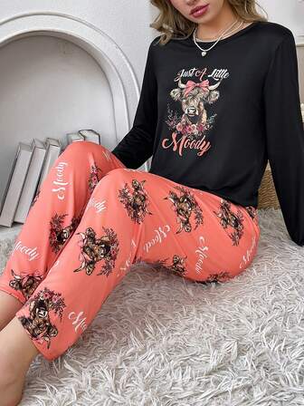 2pcs Women Pajama Set, Cartoon Highland Cow & Slogan Print Crew Neck Long Sleeve Top And Long Pants, Cute Black Sleepwear Set, Ladies Casual Homewear Suit, Comfortable Matching Pajama Set