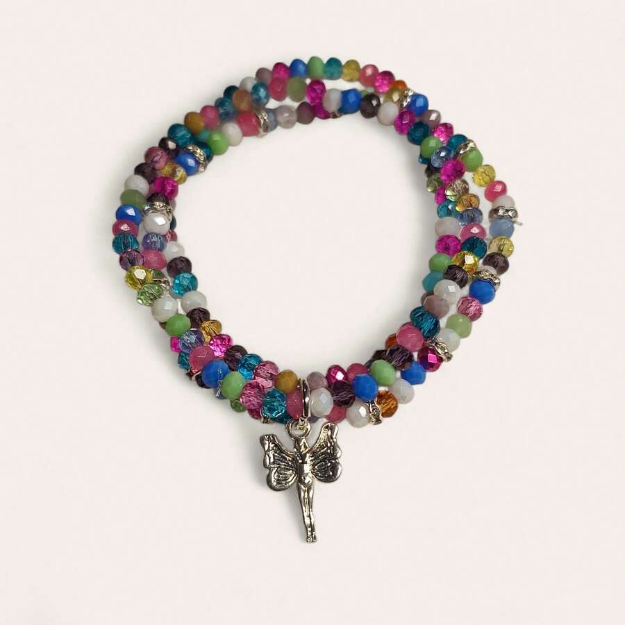 Pulsera de cuentas multicolor con dije de hada plateada. Su diseño lleno de brillo y color representa alegría , protección y energía positivo, Ideal para combinar con cualquier outfit , aporta estilo y buena vibra. - Multicolor - Ver 1