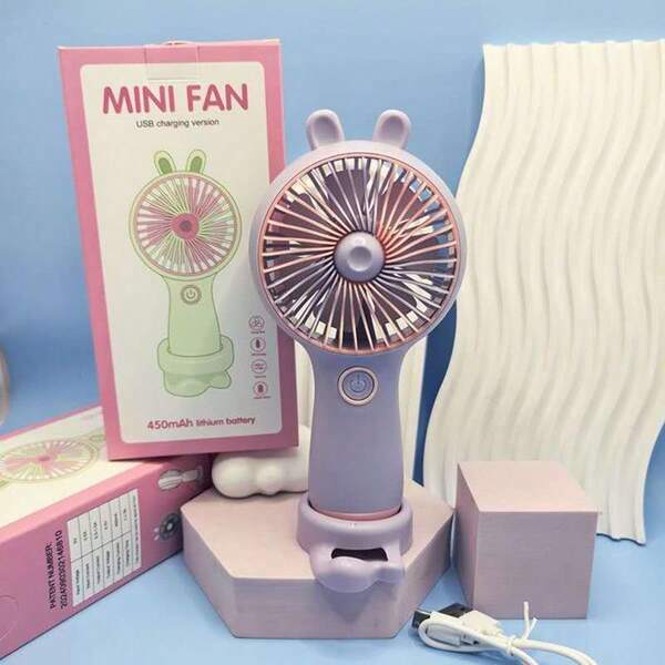 Ventilador portátil de oído de conejo con soporte para móvil, modelo recargable, mini ventilador de tres velocidades ajustables en la mesa.