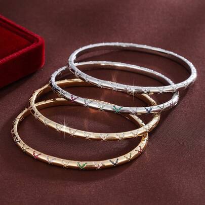 سوار نسائي بتصميم على شكل X مرصع بالزركونيا المكعبة