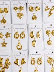 Bộ trang sức 24 món bằng thép không gỉ với họa tiết trái tim hình học và hoa lá, lấy cảm hứng từ phong cách Trung Đông Dubai, mang đến vẻ hiện đại rạng rỡ. Thích hợp làm quà cưới, trang trí tiệc, quà năm mới hoặc phụ kiện đa năng cho mọi mùa (mẫu ngẫu nhiên). - Nhiều màu - Xem 4