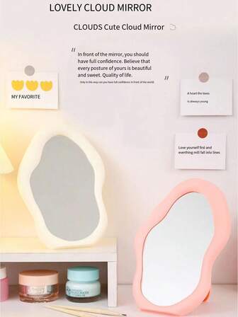 A Cloud-Shaped Vertical Makeup Mirror With An Irregular Curved Design - Featuring A Pink Mint Green And Beige Plastic Frame. It Is A Portable Wall-Mounted Vanity Mirror Suitable For Use In Bathrooms, Dressing Tables, Or As A Decorative Item. No Electricity Is Required; It Is A Bathroom Mirror.