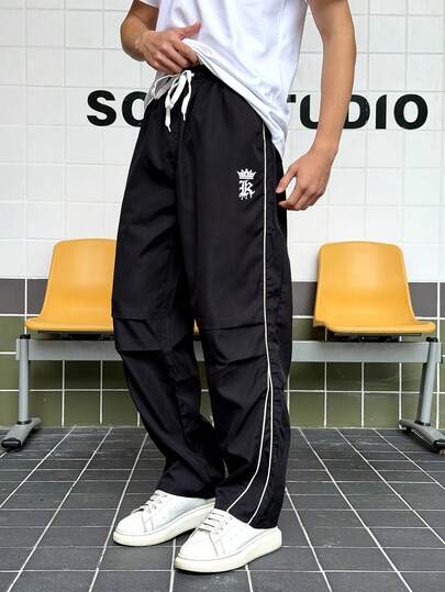 男士宽松皇冠印花抽绳直筒休闲裤，适合日常及户外穿着