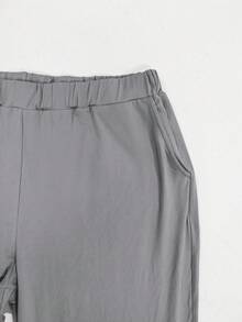 Bộ đồ nữ 2 món gồm áo dệt kim ôm dáng màu trơn và quần dài, thích hợp cho mùa xuân/hè. - Xám - Xem 4