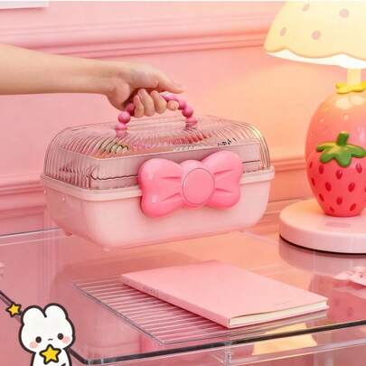 粉色蝴蝶结多层折叠收纳盒，配有可180°展开的透明顶盖，适用于存放珠宝和发饰。